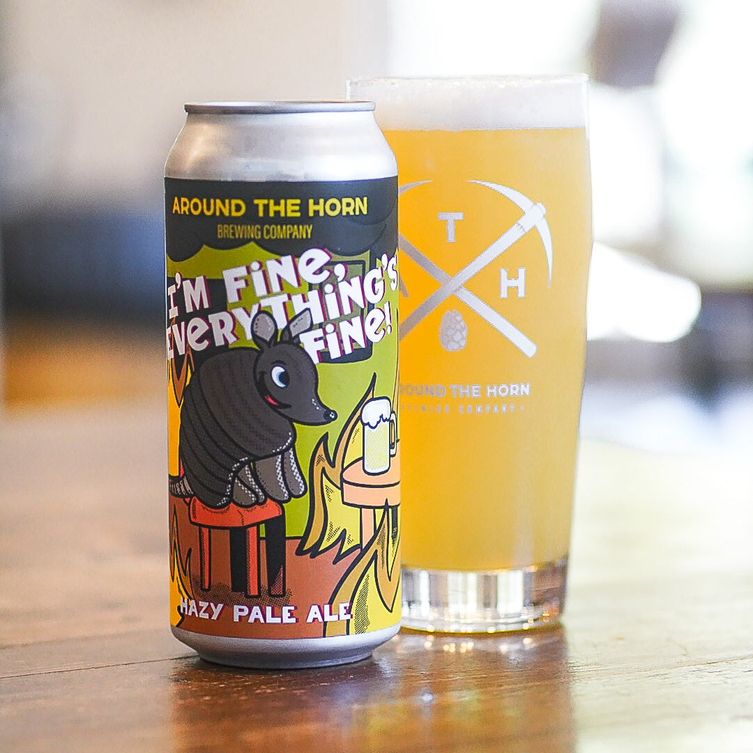 I'm Fine, Everything's Fine can and beer in glass on a wood table.